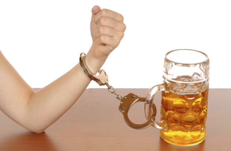 women_handcuffed_to_alcohol_drink